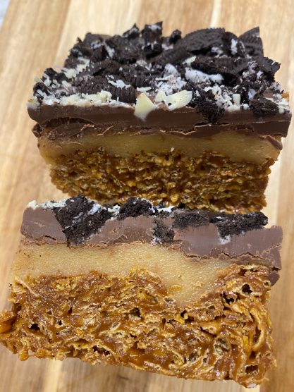 Salted caramel cornflake base, layered with thick caramel, topped with chocolate and Oreos.